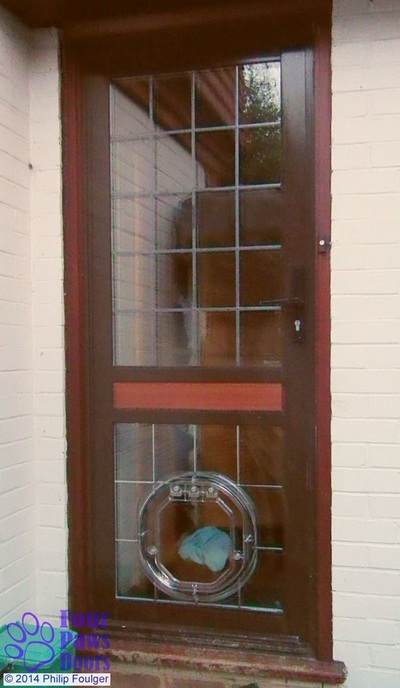 Dog door in leaded glass door