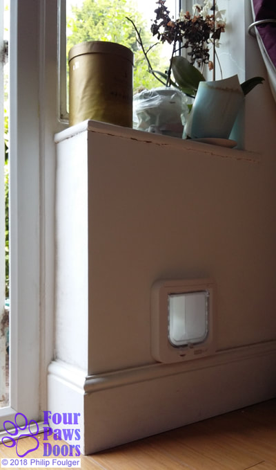 SureFlap cat flap fitted to wall