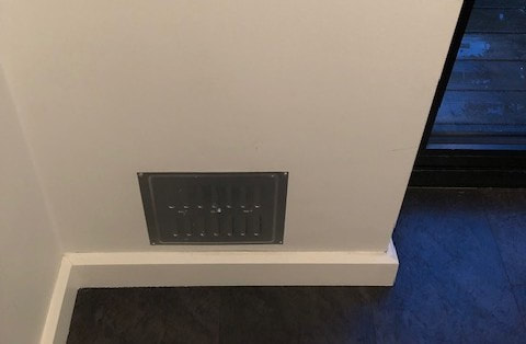 Cat flap installed in wall air vent